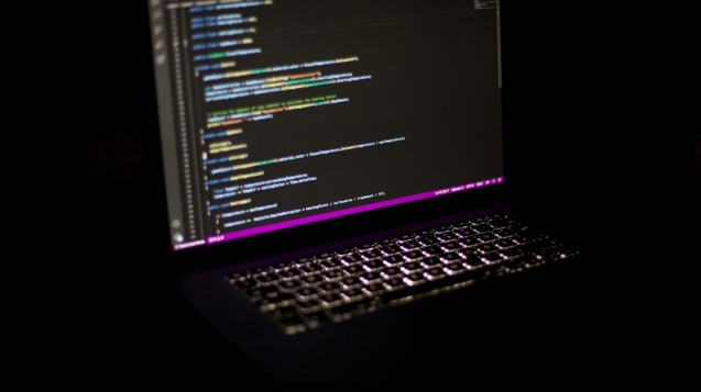 a laptop computer sitting on top of a table